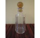 Whiskey decanter in cut glass with a yellow cap