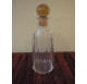 Whiskey decanter in cut glass with a yellow cap