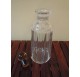 Whiskey decanter in cut glass with a yellow cap