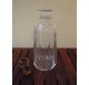Whiskey decanter in cut glass with a yellow cap