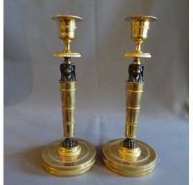 Pair of Empire period candlesticks, return from Egypt
