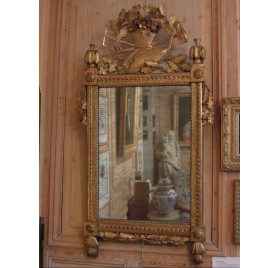 Mirror with gardener's tools in gilded and carved wood, Louis XVI period