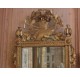 Mirror with gardener's tools in gilded and carved wood, Louis XVI period