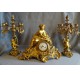 Chiseled and gilded bronze fireplace clock set