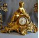 Chiseled and gilded bronze fireplace clock set