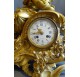 Chiseled and gilded bronze fireplace clock set