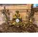 Chiseled and gilded bronze fireplace clock set