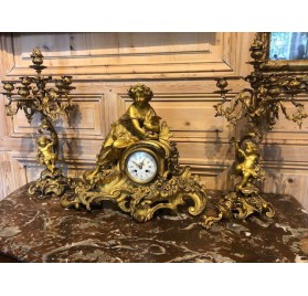 Chiseled and gilded bronze fireplace clock set