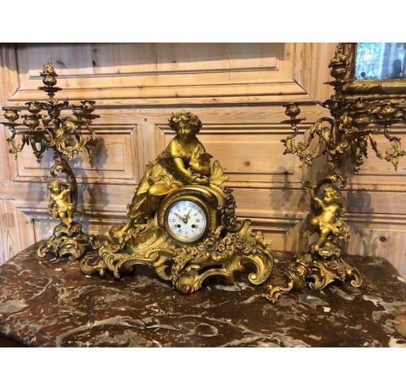 Chiseled and gilded bronze fireplace clock set
