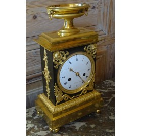 Empire period clock in gilded and patinated bronze by Mesnil