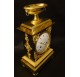 Empire period clock in gilded and patinated bronze by Mesnil