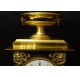 Empire period clock in gilded and patinated bronze by Mesnil