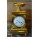 Empire period clock in gilded and patinated bronze by Mesnil