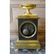 Empire period clock in gilded and patinated bronze by Mesnil