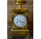 Empire period clock in gilded and patinated bronze by Mesnil