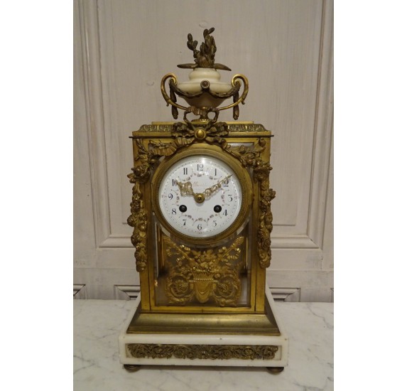 Louis XVI style cage clock in gilded bronze by Vincenti ​