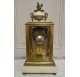 Louis XVI style cage clock in gilded bronze by Vincenti ​