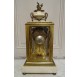 Pendule cage de style Louis XVI en bronze doré par Vincenti