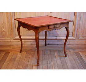 Table de milieu en merisier et cuir rouge